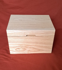 Box with finger recess