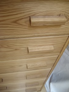 Tall chest of drawers in oak