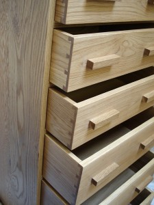 Tall chest of drawers in oak